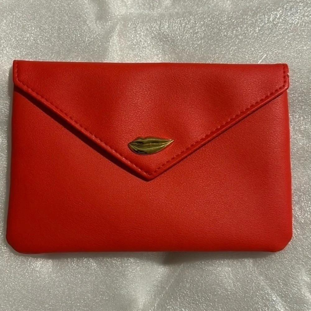 IPSy cosmetic red bag